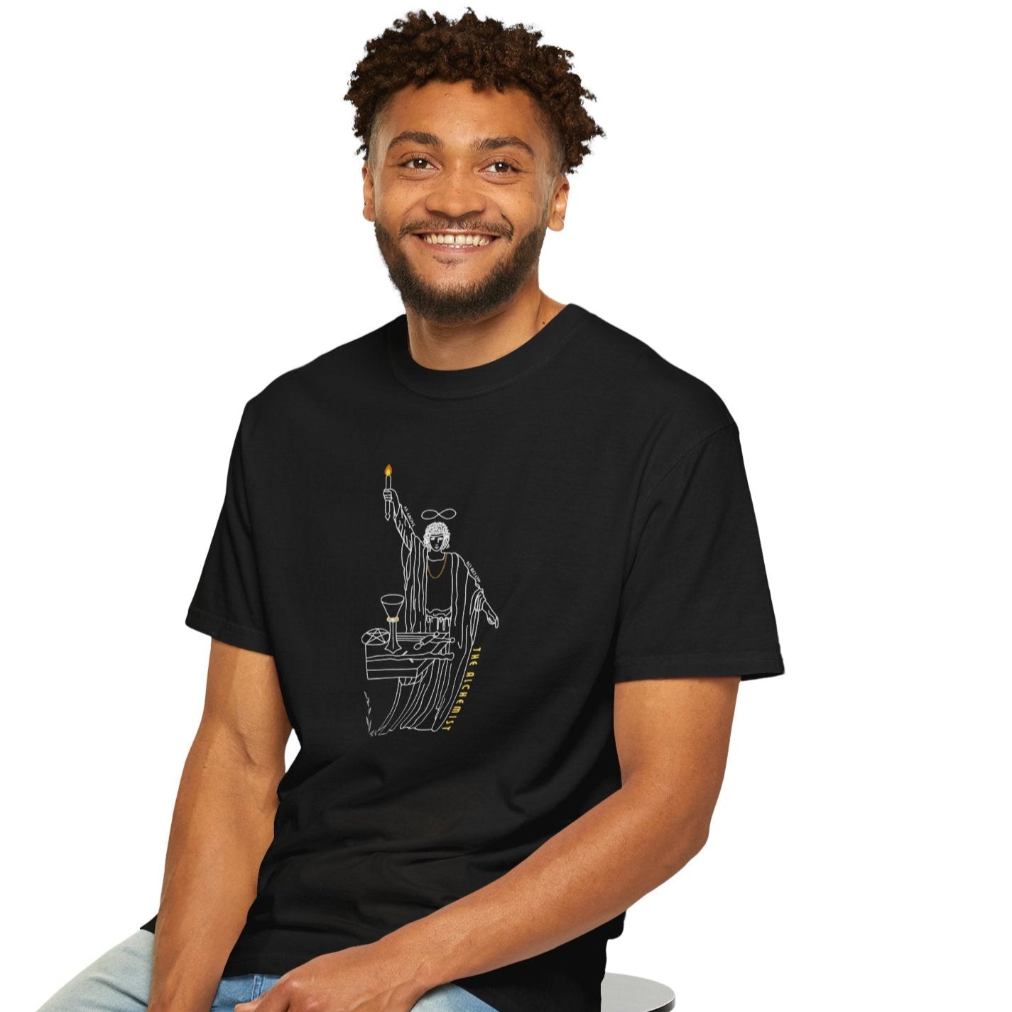 Man wearing a black t-shirt with a white graphic design of a magician.